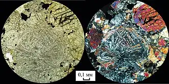 The meteorite under microscopic view (scale: 0.1&nbsp;mm)