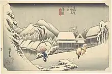  A village in a mountainous landscape. A man with a conical hat and a cane, and a saddled horse can be seen in the foreground. Japanese characters are seen in the down left and top central parts of the image.