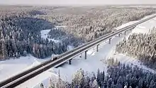 The highway in Priozersky District of Leningrad Oblast. Smorodinka River (Volchya tributary)&nbsp;[ru] flows beneath the bridge on the 46th km of the route.