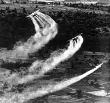 Three U.S. Fairchild UC-123B aircraft spray Agent Orange as part of the overall herbicidal warfare operation in Vietnam called Trail Dust, circa 1962–1971