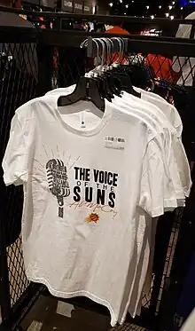 Rack of Al McCoy T-shirts showing his many catchphrases.