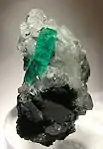 Muzo emerald on calcite5.3 cm × 3 cm × 3 cm (2.1 in × 1.2 in × 1.2 in)