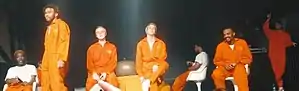Brockhampton performing in 2018; from left to right: Merlyn Wood, Kevin Abstract, Joba, Matt Champion, Dom McLennon, Ameer Vann and Romil Hemnani