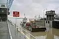 Coast Guard buoy tender Obion entering main lock at McAlpine Locks, 1999