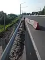 Destruction of asphalt on the Friendship Peoples' Avenue near Zaton bridge