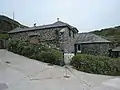 Fish cellars at Church Cove, England, used for pressing salted pilchards into barrels for storage and export to the continent