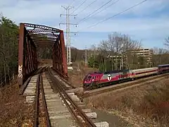 Lattice truss bridge over Fitchburg Line in Weston, unimproved