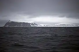 The southernmost point, Kapp Thor, and the highest point, Iversenfjellet (370&nbsp;m) seen from south