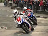 Newcomers Race 'A' John Simpson (7) 675&nbsp;cc Triumph & Kamil Holan (9) 600&nbsp;cc Yamaha – Lap 1 Parliament Square, Ramsey Saturday 25 August 2012