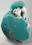 Large deep-turquoise amazonite crystal with attached stark-white microcline, from Konso, SNNPR, Ethiopia. Size: 16.4&nbsp;cm ×&nbsp;11.9&nbsp;cm ×&nbsp;8.0&nbsp;cm (6.5&nbsp;in ×&nbsp;4.7&nbsp;in ×&nbsp;3.1&nbsp;in).