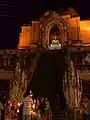 Offerings to a Buddha image at Wat Chedi Luang during Tam Bun Khan Dok