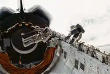 Musgrave, left, and Peterson float in Challenger's payload bay during the EVA.