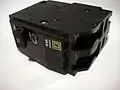 A modern 20-ampere double-pole Square&nbsp;D circuit breaker.