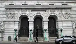 Photograph of the Chambers Street entrance showing three double-height arched doorways