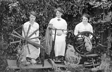 Spinning wool to knit socks for soldiers during World War I 1915