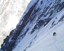 Traverse of the first ledge of Kunyang Chhish East.
