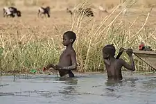 Children fishing in Lake Maga.