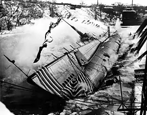 Hawkbill (SS-366), launches sideways into the Manitowoc River on 9&nbsp;January&nbsp;1944.