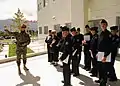 A Greek special forces representative from the NMIOTC speaks with students from the Willard High School, as part of an annual program that allows the students to get an up-close look at the various branches of the U.S. armed forces.