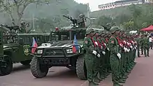 UWSA female soldiers stand at attention during ceremonies