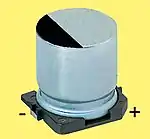 Cylindrical styles with a wound cell in a metal case are available as SMDs (V-chips) or as radial leaded versions (single-ended) for polymer or hybrid polymer aluminum capacitors