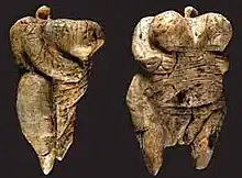 Two views of the Venus of Hohle Fels figurine, 40,000 BC–35,000 BC (6&nbsp;cm (2.4&nbsp;in) tall), one of the earliest known, undisputed examples of a depiction of a human being