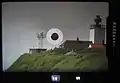 Camera viewfinder with 300&nbsp;mm telephoto lens and 2x teleconverter.